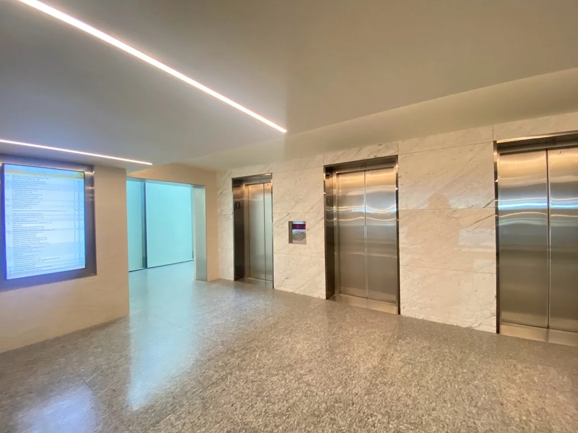 Elevator lobby with stainless steel passenger elevators