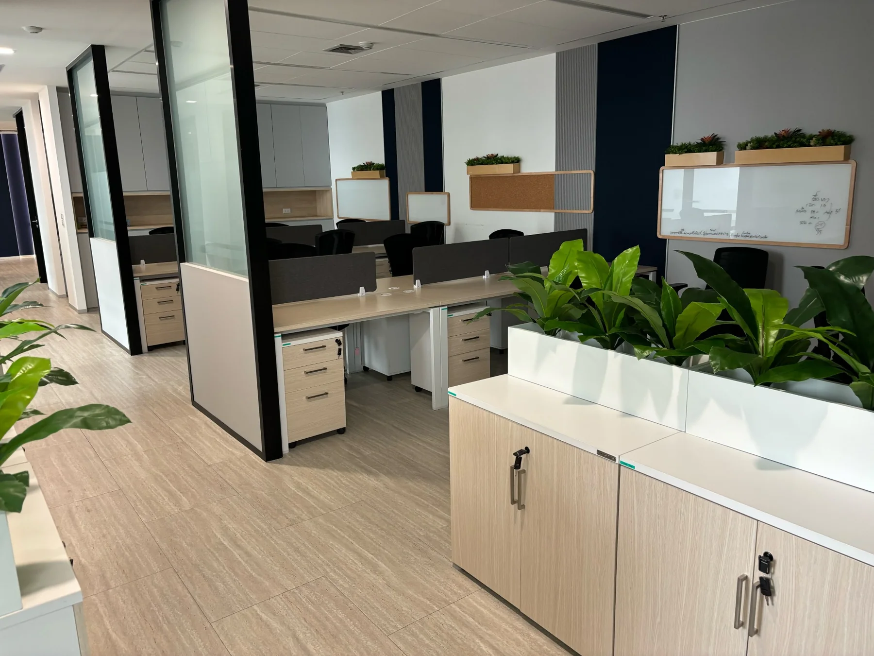 Bright furnished office area with modern workstations
